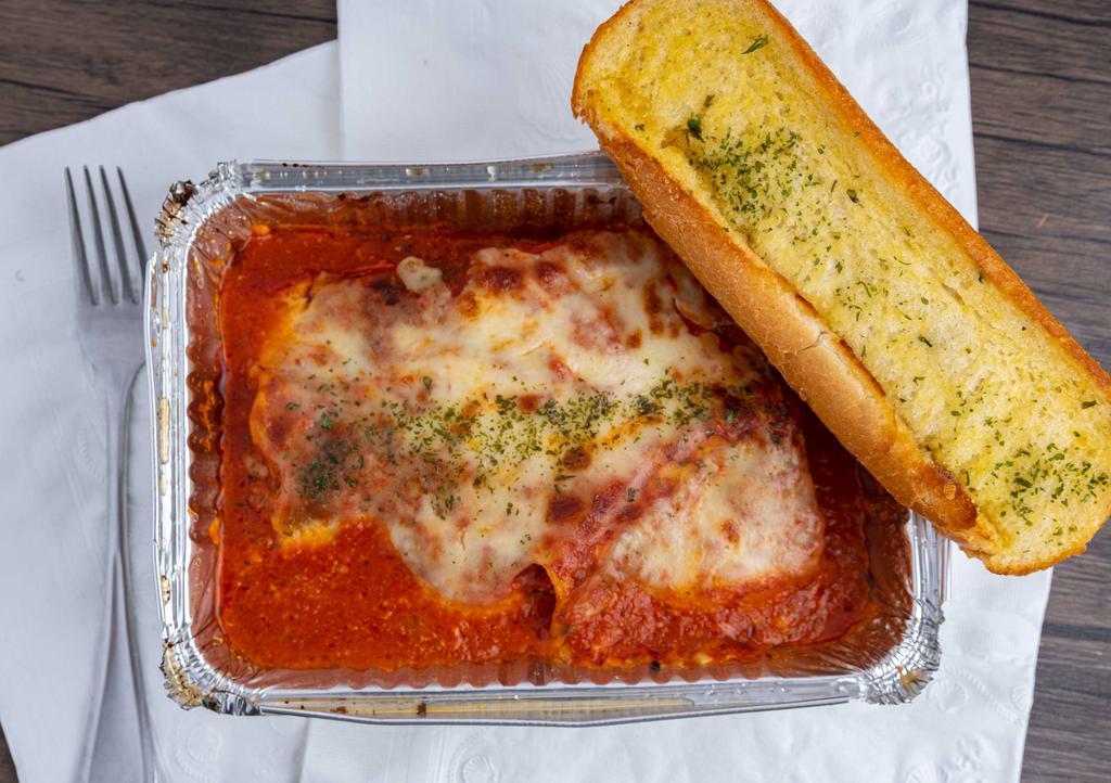 Lasagna · With garlic bread. Includes garlic bread.