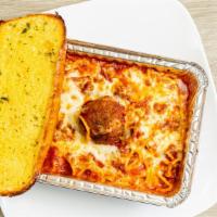 Baked Spaghetti · Pasta baked with meat sauce and topped with mozzarella cheese. Includes garlic bread.