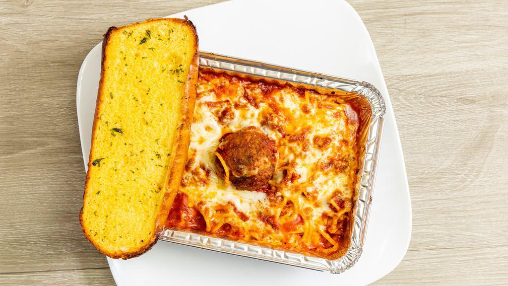 Baked Spaghetti · Pasta baked with meat sauce and topped with mozzarella cheese. Includes garlic bread.