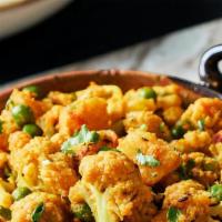 Aloo Gobi · Lightly boiled cauliflower & potatoes with tomatoes cooked with cumin & spices.