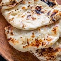 Butter Naan · Unleavened, tandoori baked bread with butter.