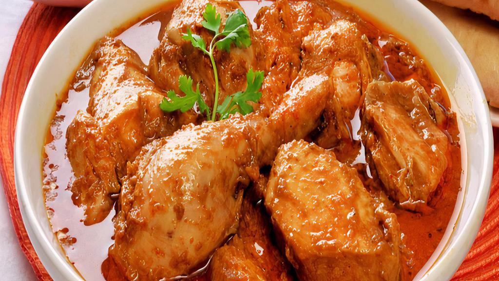 Chicken Korma · A Famous North Indian style chicken cooked with middle spicy cashew & Cream sauce gravy