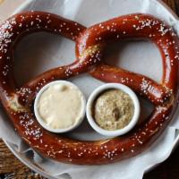 Pretzel · Large soft pretzel with beer cheese dipping sauce & whole grain mustard.