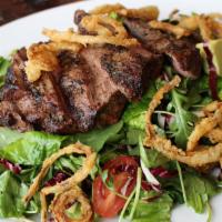 Steak Salad · Mixed greens, flat iron steak, tomatoes, avocado, crispy onions & house vinaigrette.