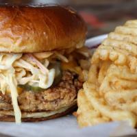 Chicken Sandwich · Fried chicken thigh, American cheese, sriracha mayo slaw & pickles on a burger bun.