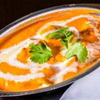 Chicken Tikka Masala · Boneless roasted chicken cooked in spices and thick creamy sauce.