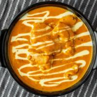Butter Chicken · Chicken cooked with cream sauce, spices and butter.