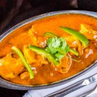 Chicken Curry · Chicken cooked in sauce and spices.