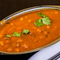 Chana Masala  · Chick peas cooked in onion, tomato ginger and garlic with spices.