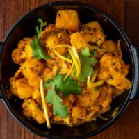 Aloo Gobi  · Potatoes and cauliflower cooked in spices.