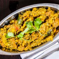 Undhiyu · Mixed vegetables cooked with spices.