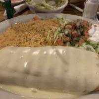 Chimichanga · You pick it - ground beef, marinated chicken or shredded beef and we'll stuff it into a larg...