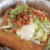 Taquitos Mexicanos · Two corn tortillas wrapped with your favorite filing. Topped with lettuce, pico de gallo, gu...