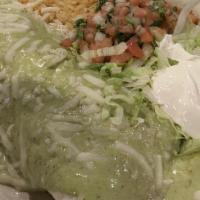Cilantro Burrito · A delicious burrito filled with steak or grilled chicken, beans Topped with cilantro sauce. ...
