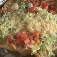 Grilled Chicken Taco Salad · Beans, rice, lettuce, tomatoes, cheese and sour cream.