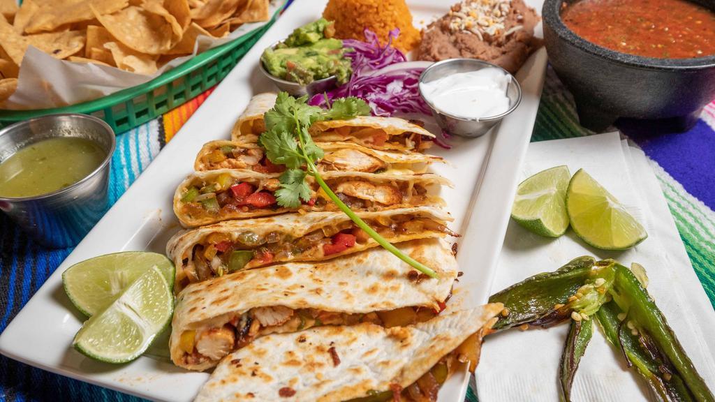 Chicken Fajitas Quesadilla · Grilled onions, red, yellow and green peppers.