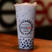 Taro Pearl Milk Tea  · Milky tea with boba pearls. Main ingredient is taro powder with a creamy taste and added wit...
