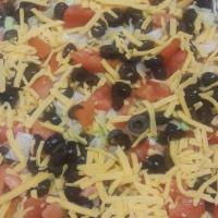 Taco Pizza · Seasoned ground beef, fresh tomatoes, crispy lettuce, jalapenos, black olives, a blend of mo...