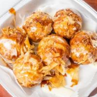6 Takoyaki · Fried round octopus dumplings drizzled with Japanese mayo, katsu sauce and topped with bonit...