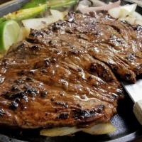 Carne Asada · Served with rice. Your choice of charro or refried beans, flour tortillas, and an avocado sa...