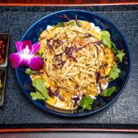 Savvy Khao Soi · Spicy. Northern thai red curry sauce, served with egg noodles, tangled crispy noodles, chick...