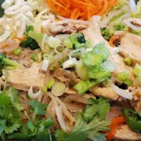 Pad Se Ew · Rice noodle tossed in with a fried egg in brown sauce, served with chicken, carrots, broccol...