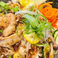 Garlic Black Pepper · Ramen noodles topped with marinated chicken breast, yellow onions, mushrooms, zucchini, and ...