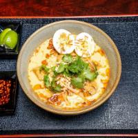 Curry Laksa Noodle Soup · Spicy. Rice noodles served in yellow and red curry broth, chicken breast, bean sprouts, hard...
