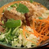 Mee Kar Thee (Peanut Noodle Bowl) · Spicy. Rice noodles in spicy creamy egg, grounded chicken, coconut and peanut sauce, julienn...
