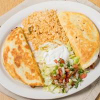 Quesadilla Ranchera · Two flour tortillas stuffed with grill chicken or steak , cheese, grilled to golden crispine...