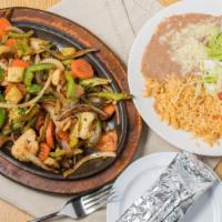 Fajitas Vegetarian · Large onions, peppers, cauliflower, broccoli, carrots, and tomatoes, covered with shredded c...