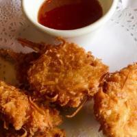 Coconut Shrimp · Five pieces. Hand dipped in batter, rolled in coconut, and fried golden served with sweet ch...