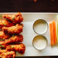 Chicken Wings · 6/12/18 wings fried or brick oven roasted tossed in your choice of Dry Herb Rub, Lemon Peppe...