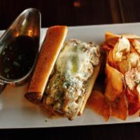 French Dip · Roasted prime rib with provolone and caramelized onions on a French Baguette with a Sweet Jo...