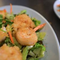 Xà Lách Sài Gòn · Fresh lettuce and flash fried shrimp seasoned in Vietnamese vinaigrette.