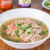 Pho · Classic Vietnamese beef broth with rice noodles, rare beef, well done beef, and meatballs se...