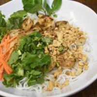 Bún Thịt Nướng · Vietnamese noodle bowl with sliced cucumber, bean sprouts, lettuce, carrots, peanuts, fresh ...