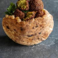 Falafel Pita · Deep-fried ball made from chickpeas vegetables and spices. This pita comes “all the way” as ...