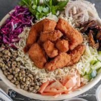 Chicken Schnitzel Bowl  · Israeli style deep-fried chicken breast. This bowl comes 
