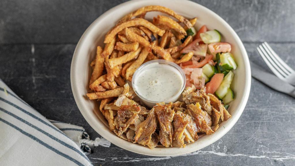 Kids Chicken Shawarma · Chicken Shawarma, fries and your choice of a salad (cucumber & tomato or sour red cabbage). Served with 1/2 pita & garlic sauce on the side. Please note which salad you'd like.