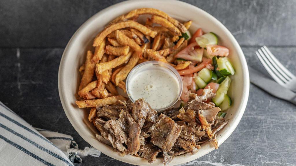 Kids Beef & Lamb Shawarma · Beef & Lamb Shawarma, fries and your choice of a salad (cucumber & tomato or sour red cabbage). Served with 1/2 pita & garlic sauce on the side. Please note which salad you'd like.