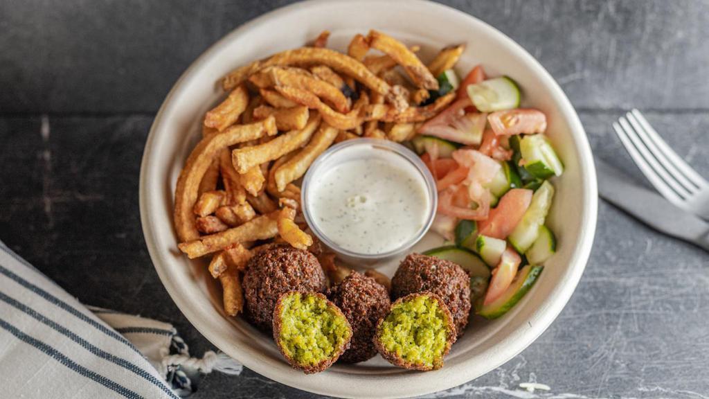 Kids Falafel (Vegan) · Falafel, fries and your choice of a salad (cucumber & tomato or sour red cabbage). Served with 1/2 pita & garlic sauce on the side. Please note which salad you'd like.