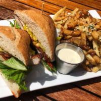 Parmesan Chicken Sandwich · Parmesan-breaded and deep-fried local chicken breast, topped with gravy, house-made mozzarel...