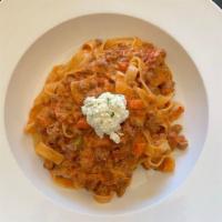 Tagliatelle Bolognese · Thinly sliced house-made tagliatelle with local beef and pancetta bolognese and house-made r...