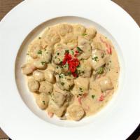 Gnocchi · House-made potato gnocchi, local mixed mushrooms, roasted red peppers, leek cream sauce, fin...