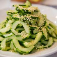 Cucumber Salad · Cut cucumbers tossed with ponzu and sesame seeds.