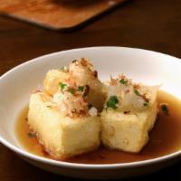 Agedashi Tofu · Lightly fried tofu. Served with tempura sauce, sriracha sauce, bonito flakes, and green onio...