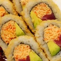 Quaran-Tuna Roll · Tuna, snow crab, avocado, rolled in crunchy. Finished off with sesame seeds and drizzled wit...