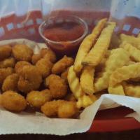 Popcorn Shrimp · A generous portion of battered and breaded shrimp, fried to a golden brown, served with stea...