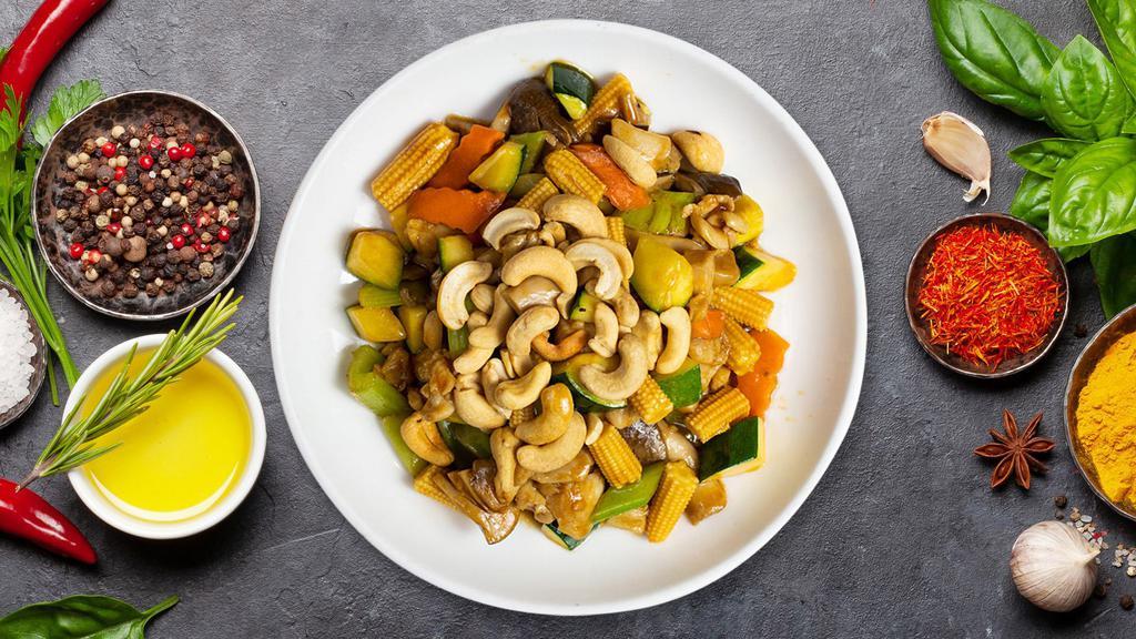 Cashew Chicken · Chicken sauteed with minced garlic, bell peppers, babay corn, carrots, onions, mushrooms, bamboo shoots, zucchini, and roasted cashews.